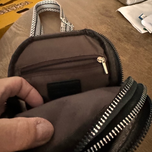 Black Vegan leather cross body bag. It has a few compartments can hold phone - Picture 3 of 4